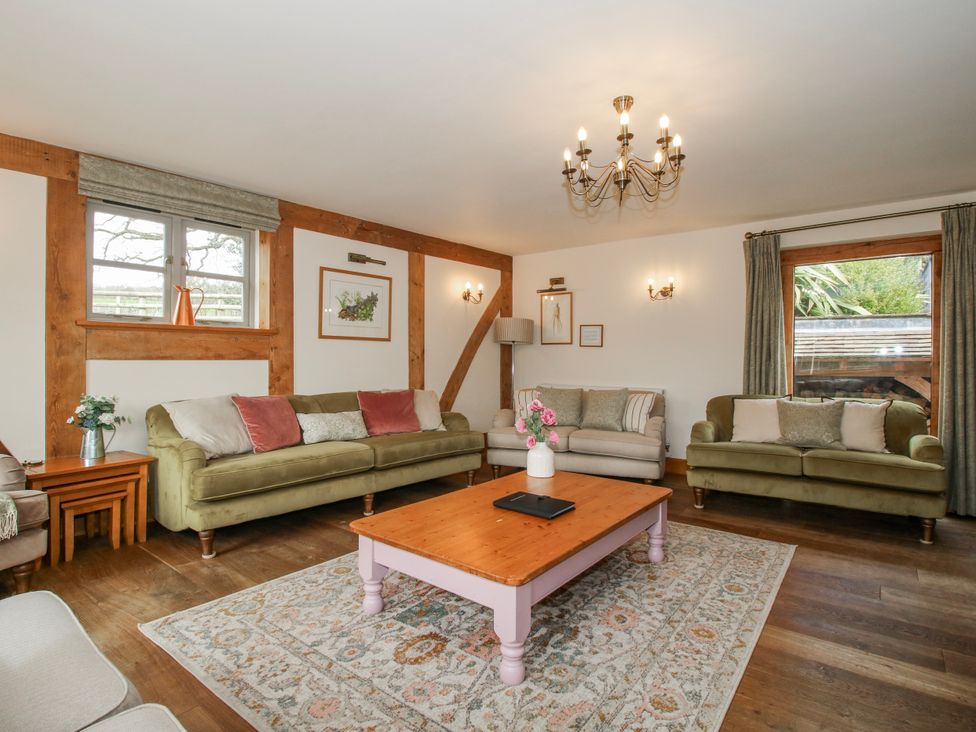 A living room with sofas and a coffee table at The Milking Parlour in Westhope