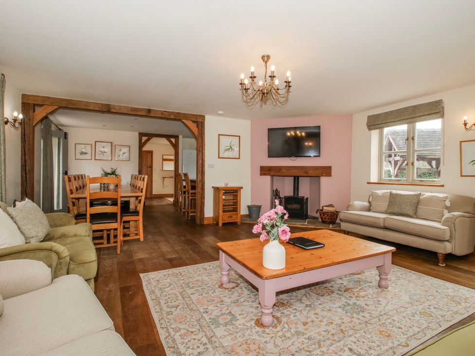 A living room with a coffee table and television at The Milking Parlour in Westhope