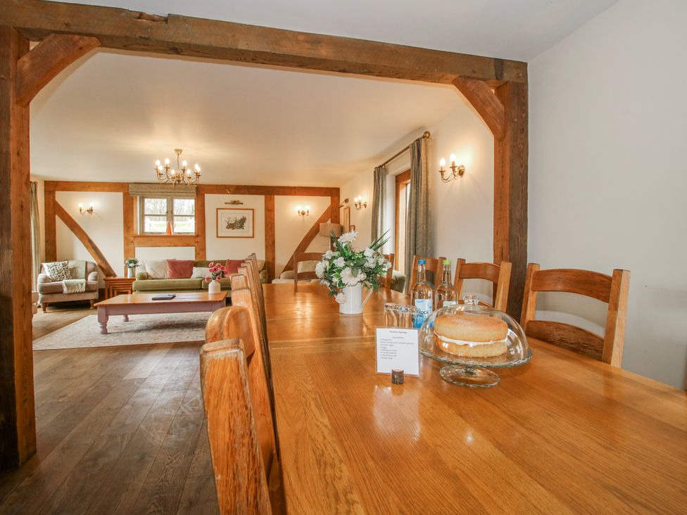 A dining room with a table and cake stand at The Milking Parlour in Westhope