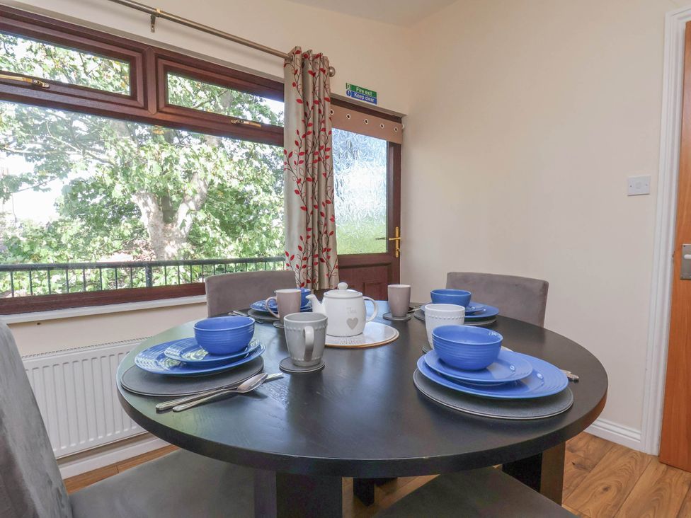 A dining room with a table set for meals at Primrose Lodge Saltburn-by-the-Sea