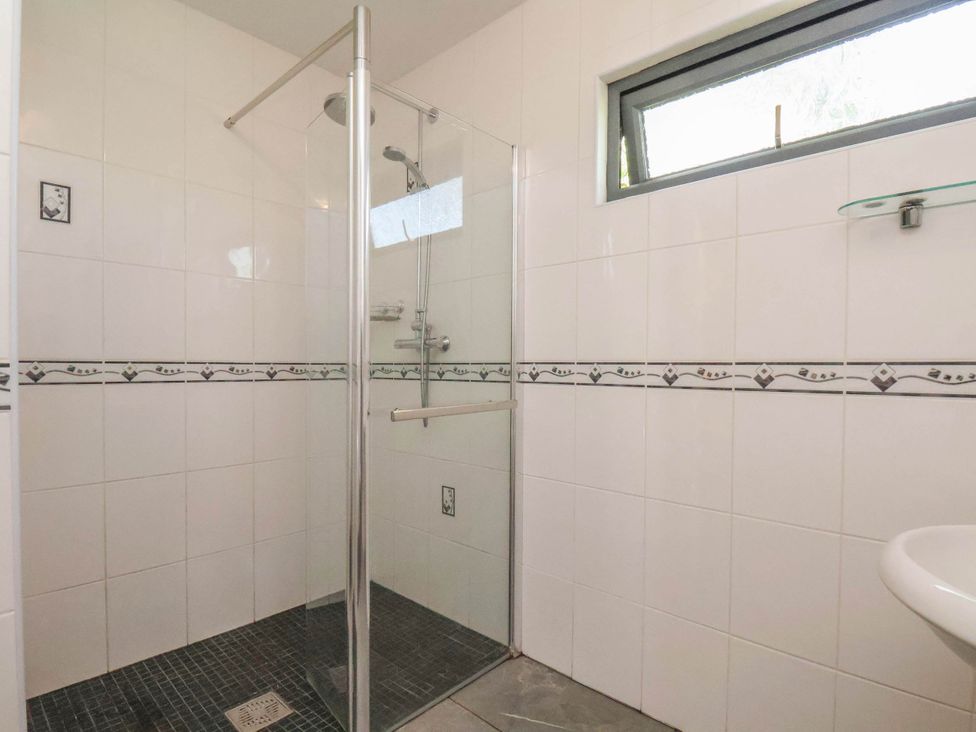 A bathroom with a shower and sink at Primrose Lodge in Saltburn-by-the-Sea
