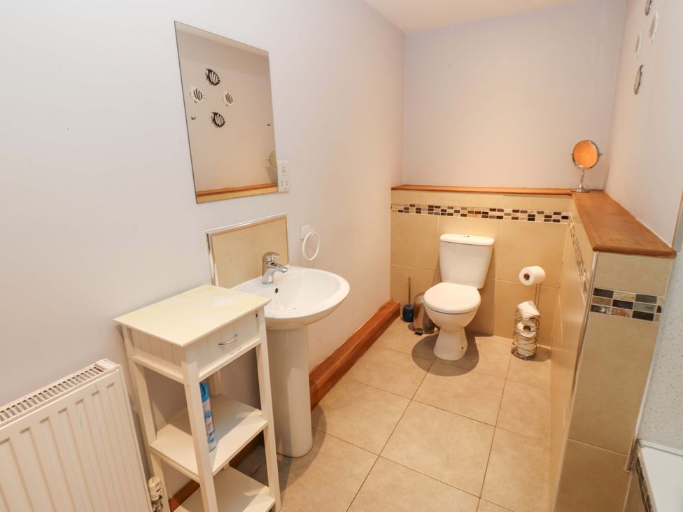 A bathroom with a sink and toilet at Cooper Cottage in Potto near Stokesley