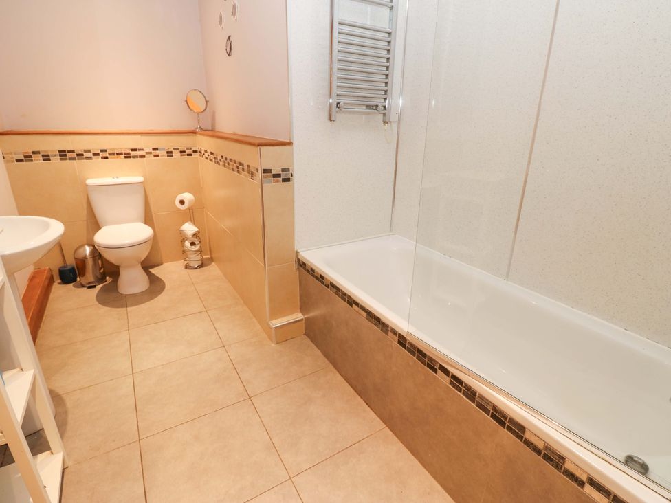 A bathroom with a toilet and sink at Cooper Cottage near Stokesley