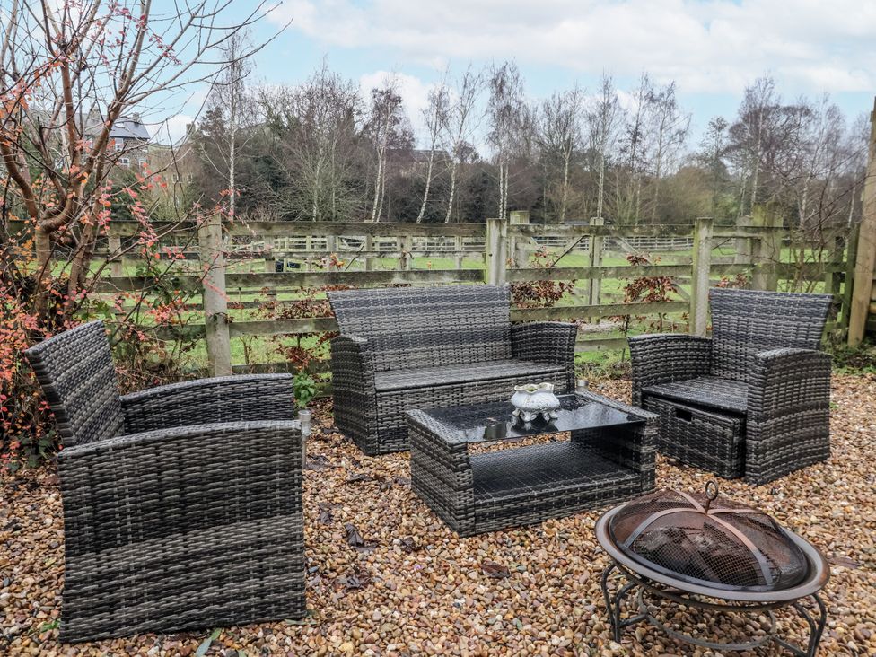 Outdoor furniture including a sofa and chairs in a garden at Lair Close Cottage Shaw Mills near Harrogate