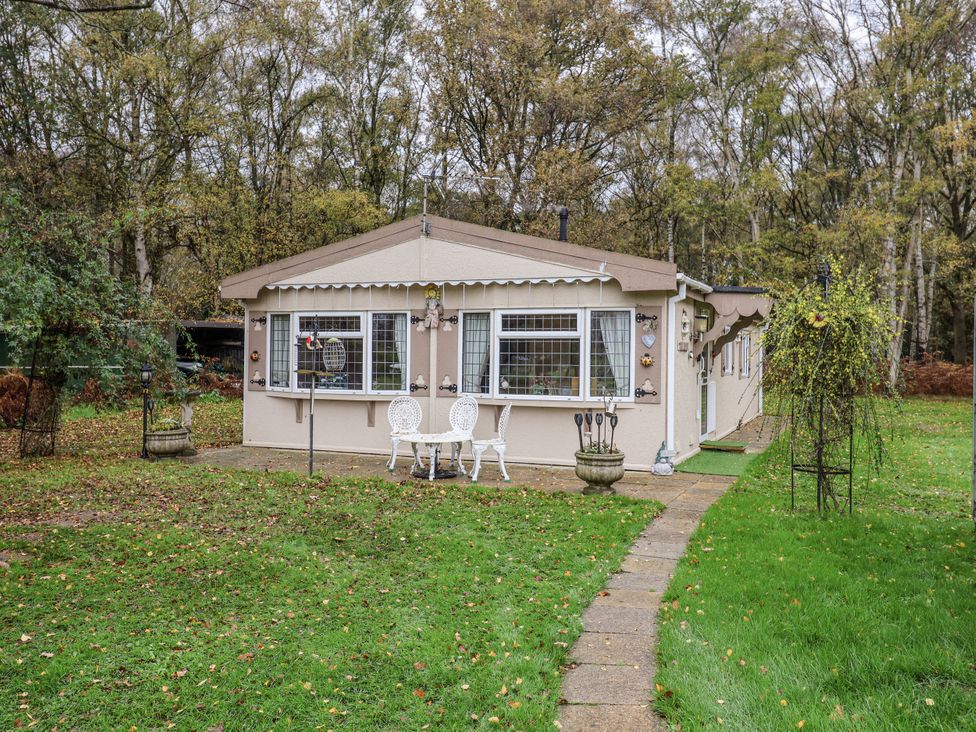 A cottage with a pathway and garden at The Lodge Old Buckenham near Attleborough