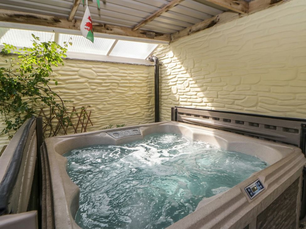 A hot tub in an indoor pool area at Yr Hen Llaethdy near Newcastle Emlyn