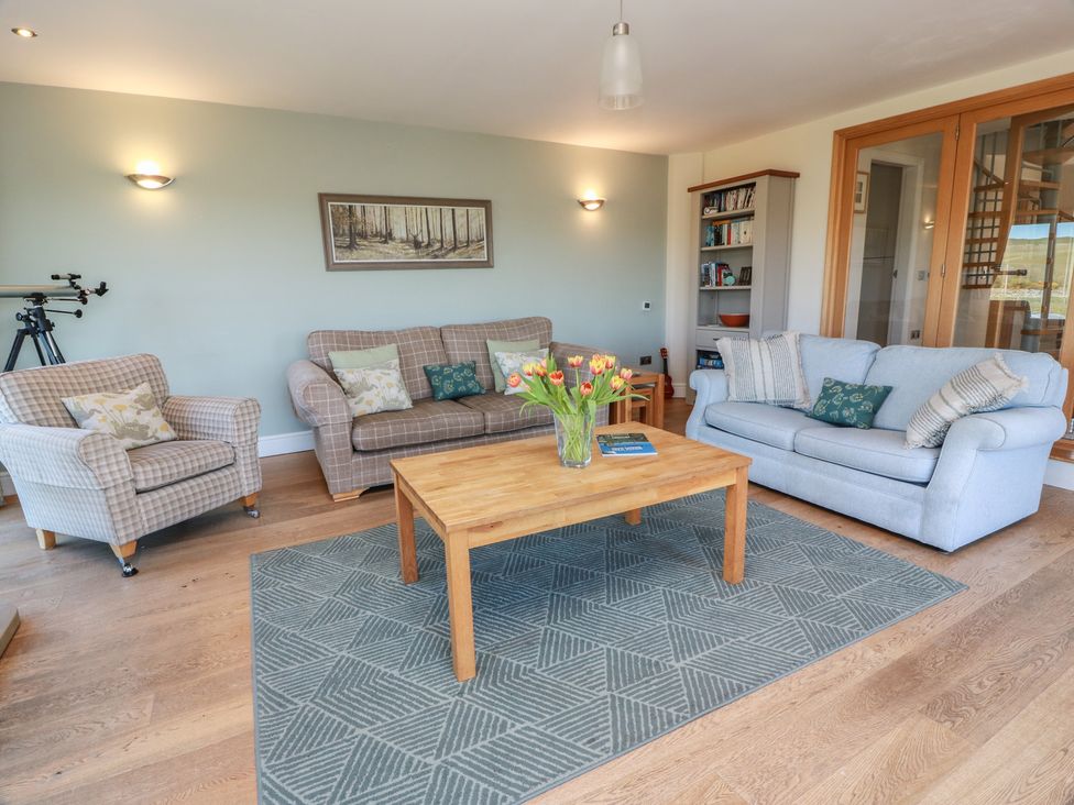 A living room with a coffee table and sofas at South Milton Cottage Stairhaven near Glenluce