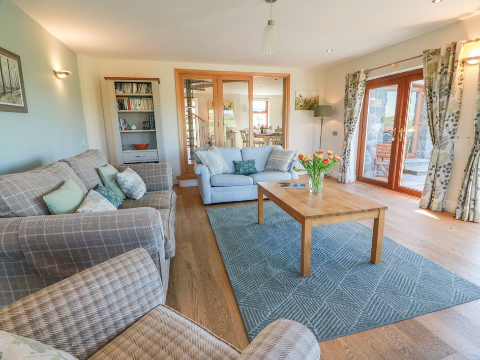 A living room with a sofa and coffee table at South Milton Cottage Stairhaven near Glenluce