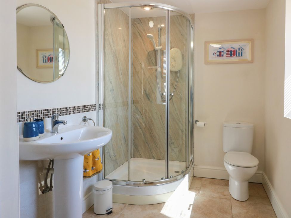 A bathroom with shower and sink at South Milton Cottage Stairhaven near Glenluce