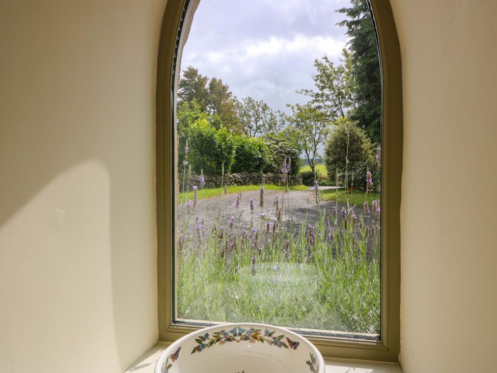 A window view overlooking a lavender garden at Muirmailing Cottage Plean near Stirling