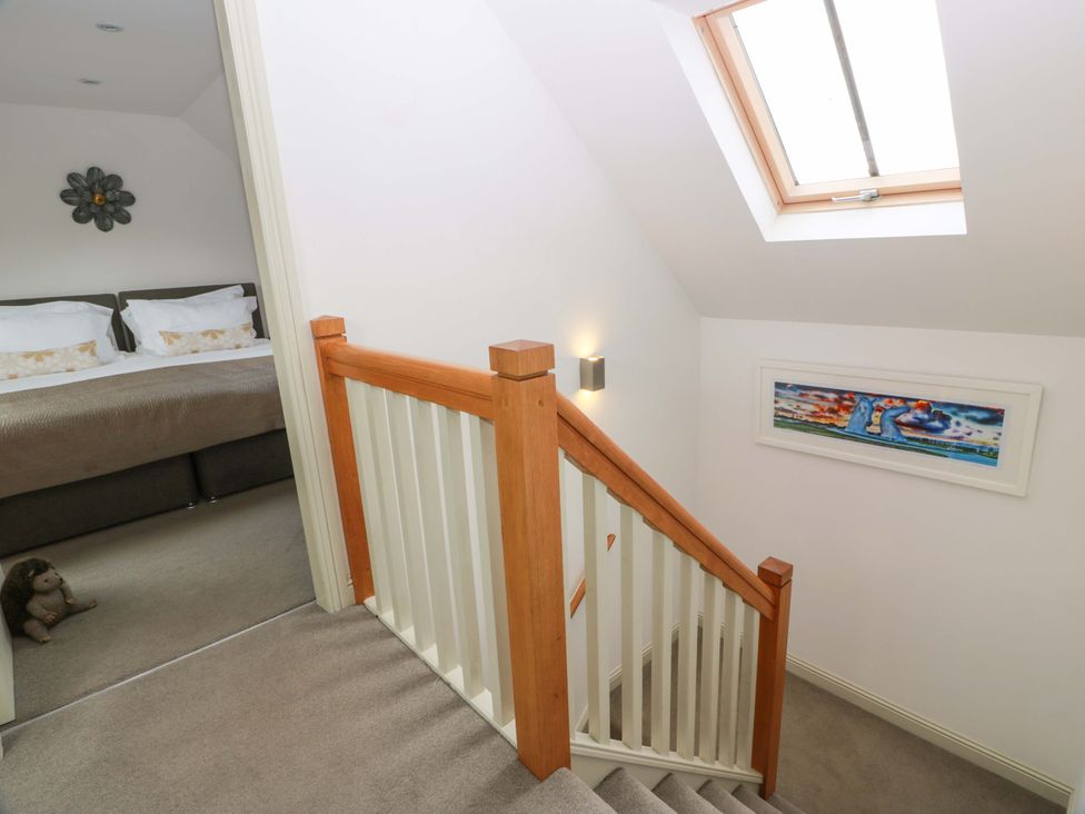 A staircase leading to a bedroom at Muirmailing Cottage in Plean near Stirling