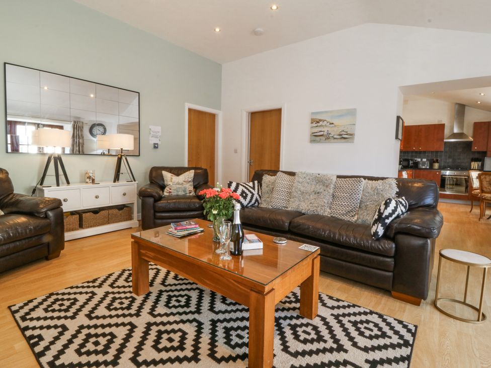A living room with sofas and a coffee table at Maritime Mews, 6 The Oakleys, Porthmadog