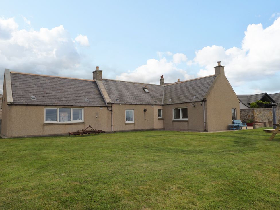A house with large windows and grass area at Braehead Croft Portessie near Buckie