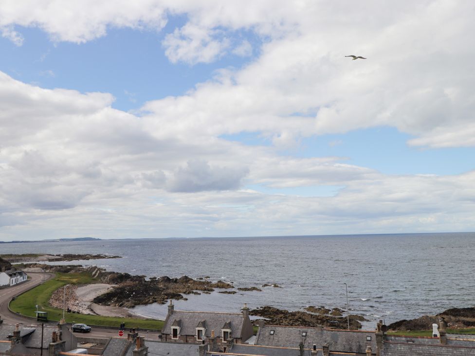 A coastal view with sea, clouds and houses at Braehead Croft in Portessie near Buckie