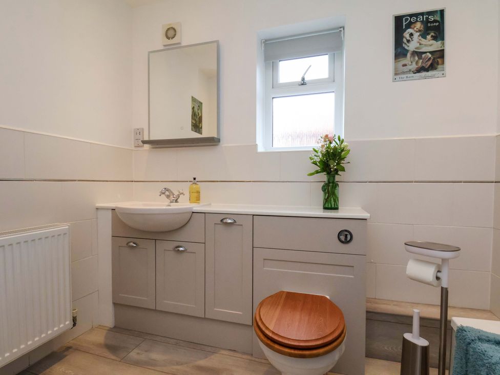 A bathroom with a sink and a toilet at Berry Banks Cottage in Whitby