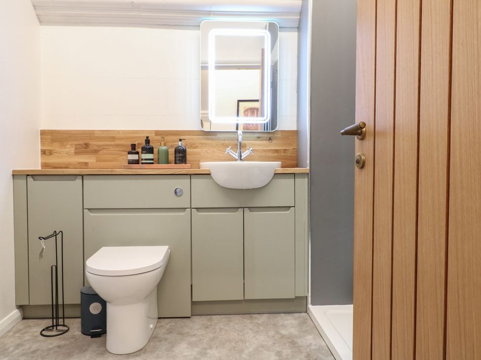 A bathroom with a sink and toilet at Shrewsbury Lodge in Great Haywood