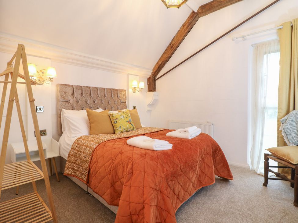 A bedroom with a bed and decor at Shrewsbury Lodge in Great Haywood