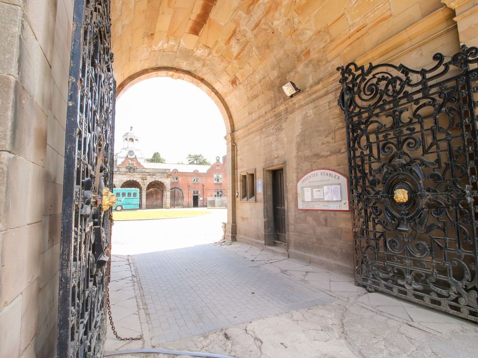An entrance with a gate and a sign at the stables at Shrewsbury Lodge in Great Haywood