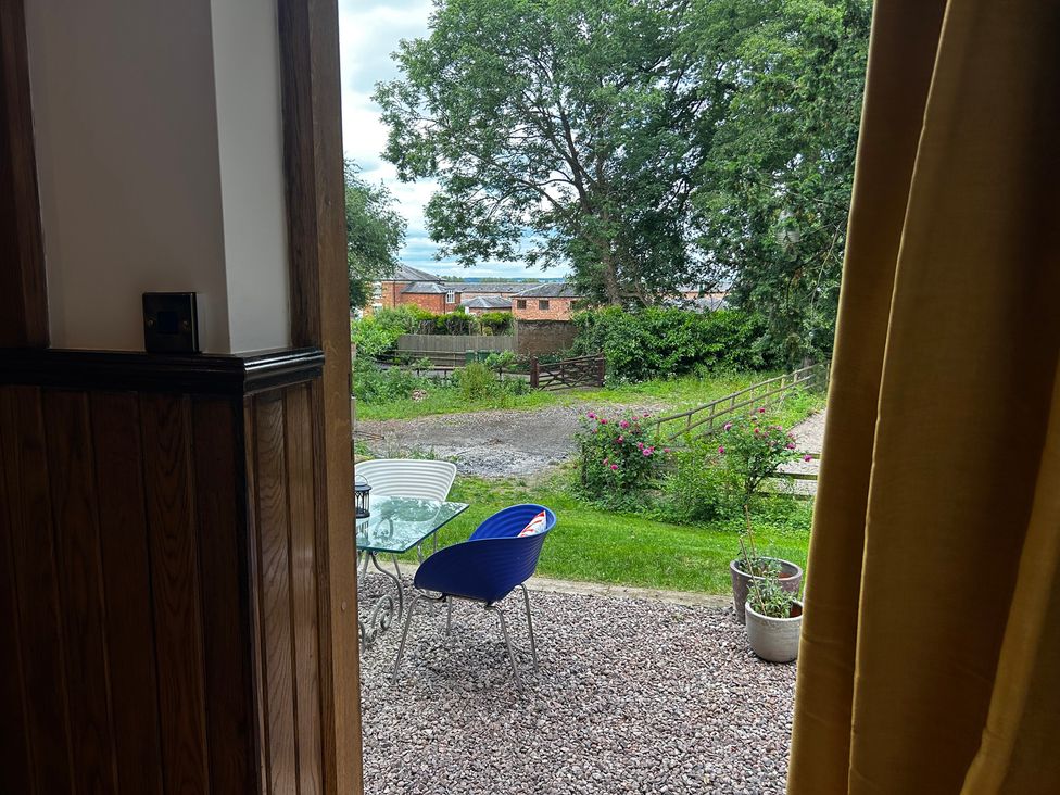 A view of a table and chairs in an outdoor area at Shrewsbury Lodge Ingestre near Great Haywood