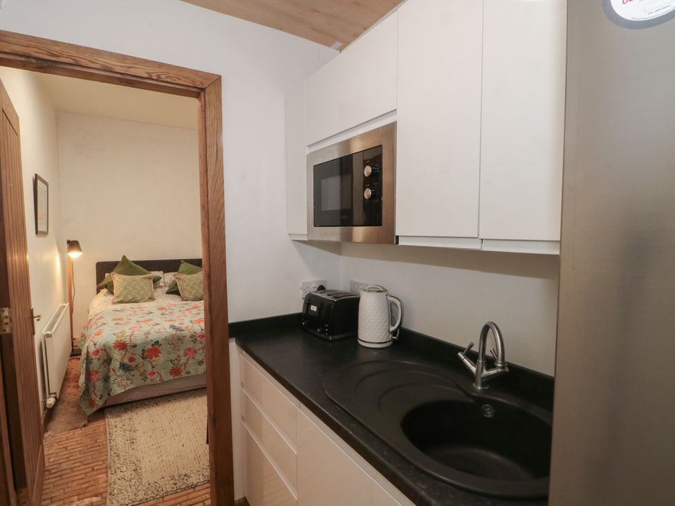 A kitchen with a sink and microwave at Diamond Lodge Ingestre near Great Haywood