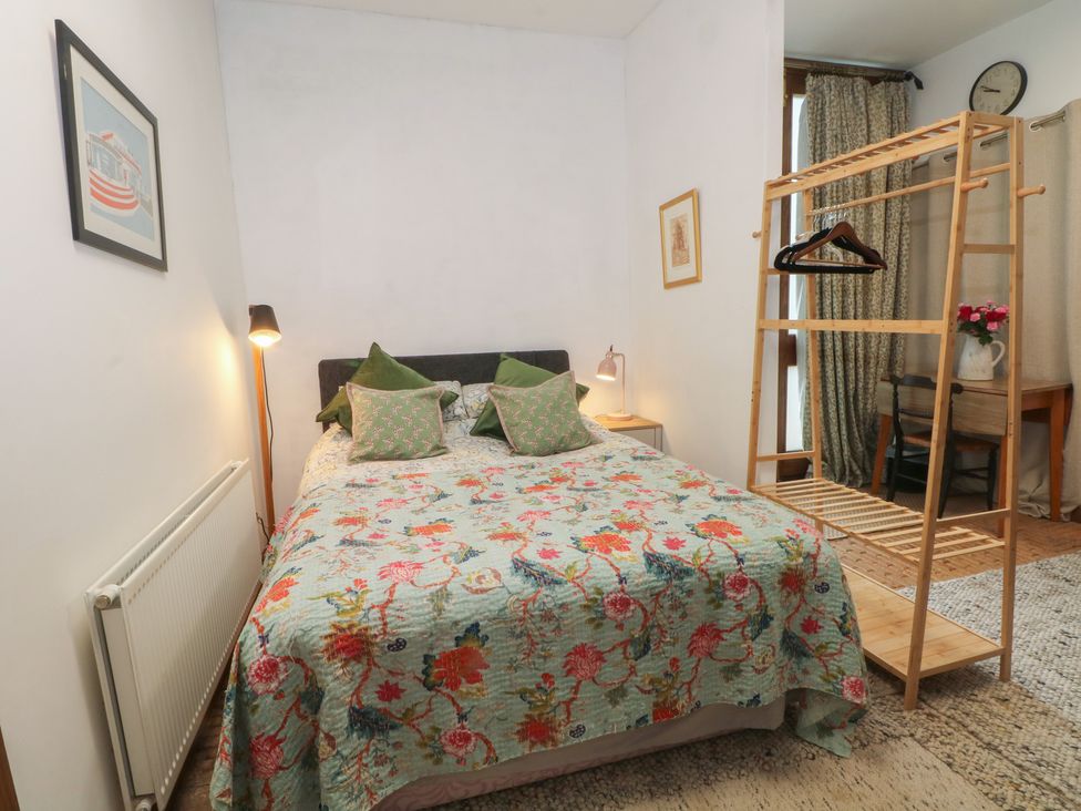 A bedroom with a bed and shelving at Diamond Lodge Ingestre near Great Haywood