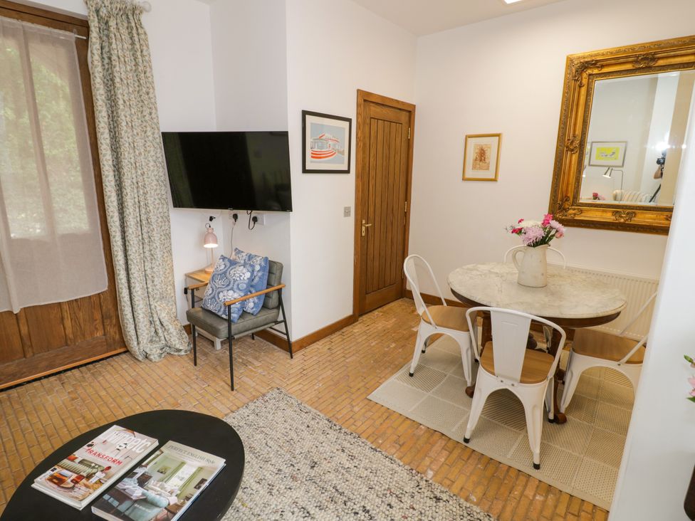 A dining room with a table and chairs at Diamond Lodge Ingestre near Great Haywood