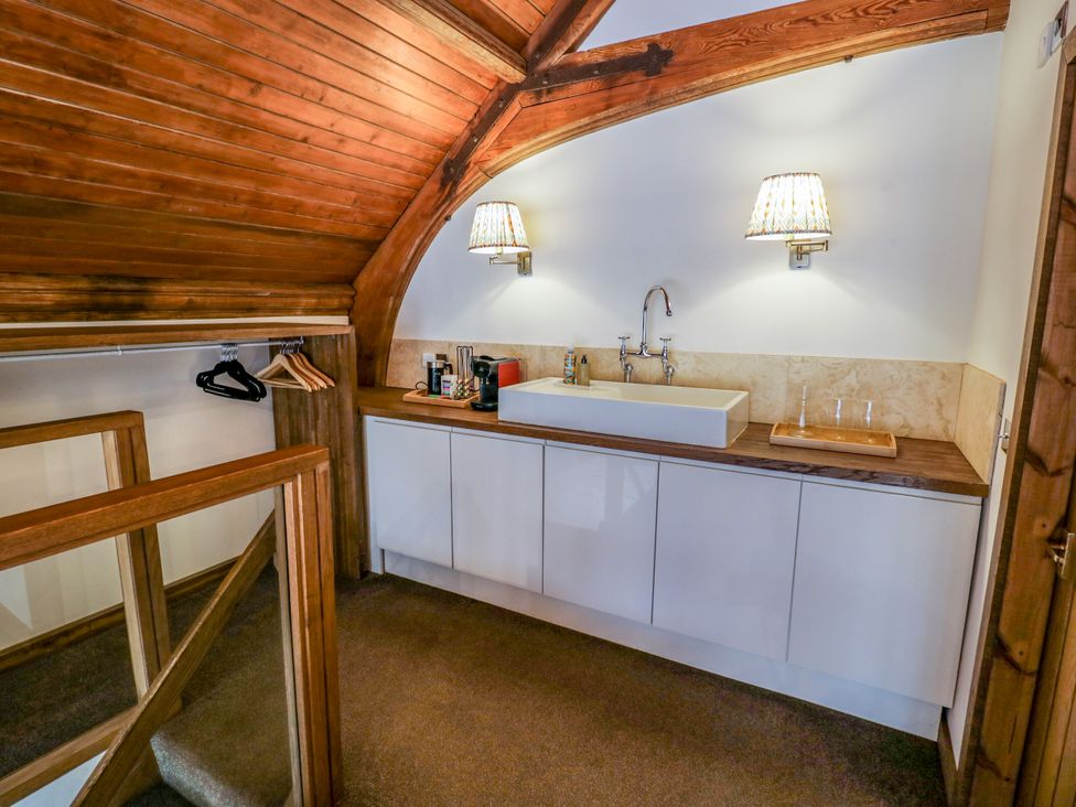 A small area with a sink and coffee maker at Diamond Lodge Ingestre near Great Haywood