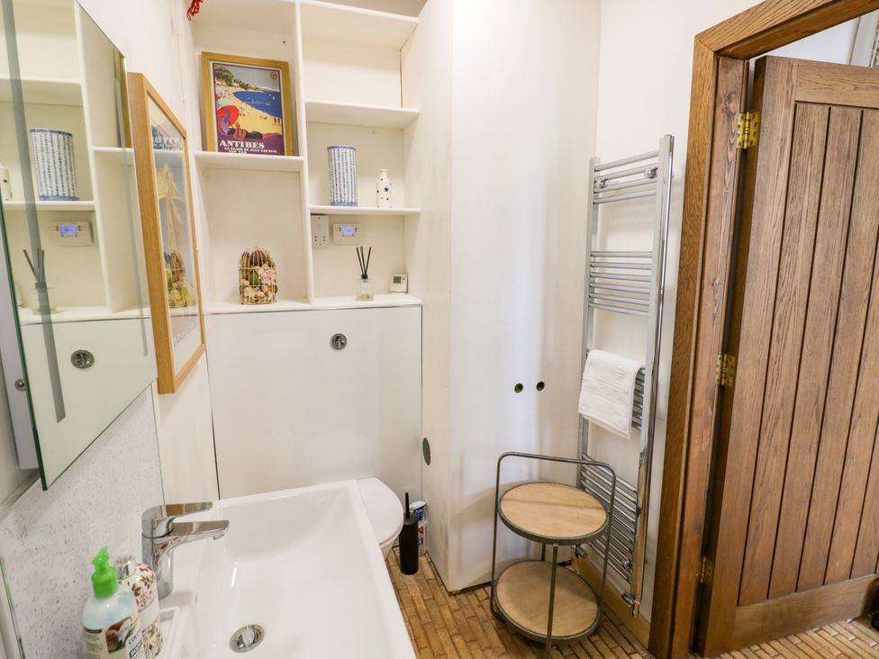 A bathroom with a sink and a mirror at Diamond Lodge Ingestre near Great Haywood
