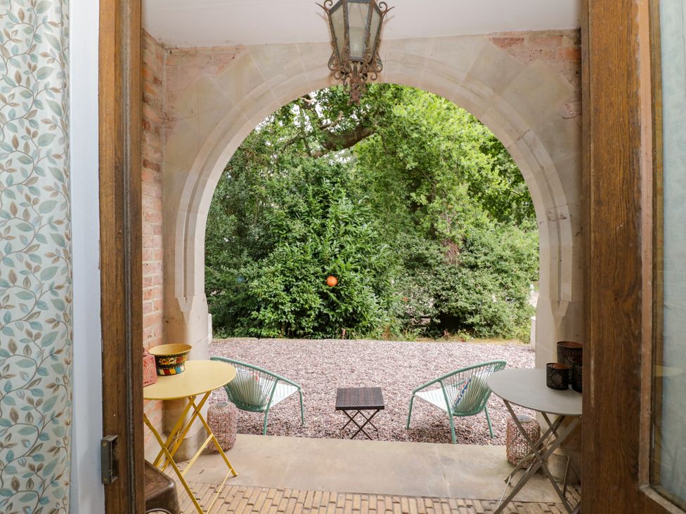 An outdoor area with a table and chairs at Diamond Lodge Ingestre near Great Haywood