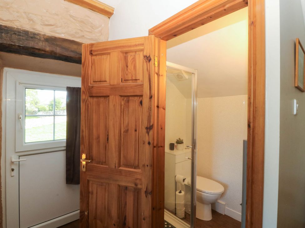 A bathroom with a shower and toilet at Tyddyn in Dyffryn Ardudwy