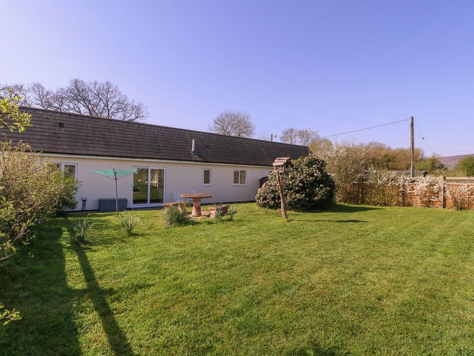 A house with a garden and table at The Turbles - Swallows Nest Castlemorton near Welland