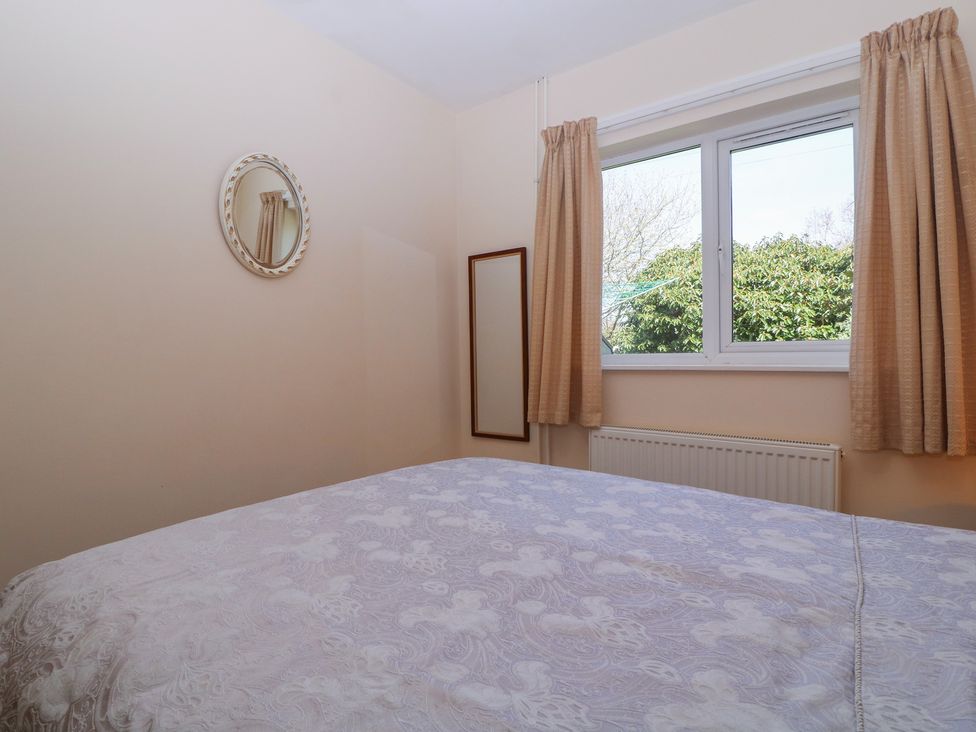 A bedroom with a bed and a window at The Turbles - Wagtail Castlemorton near Welland