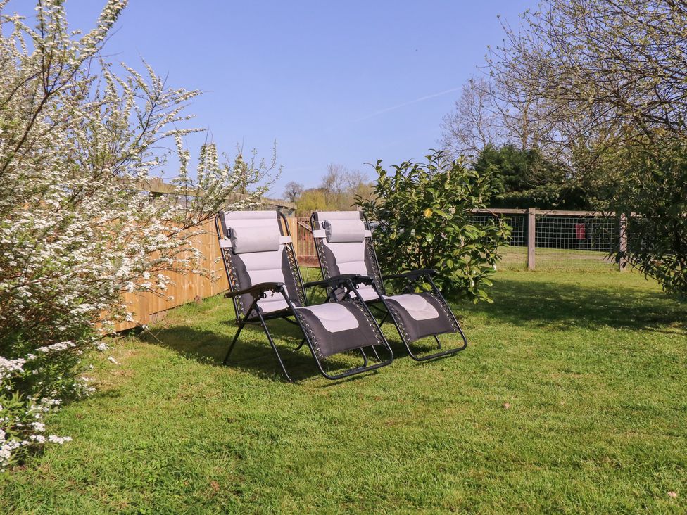 Two reclining chairs in a garden at The Turbles - Wagtail near Castlemorton