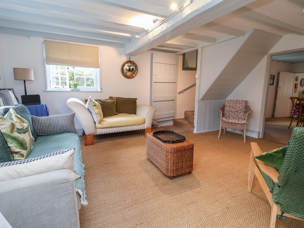 A living room with a sofa and coffee table at Wolvesacre Mill Cottage Agden near Whitchurch