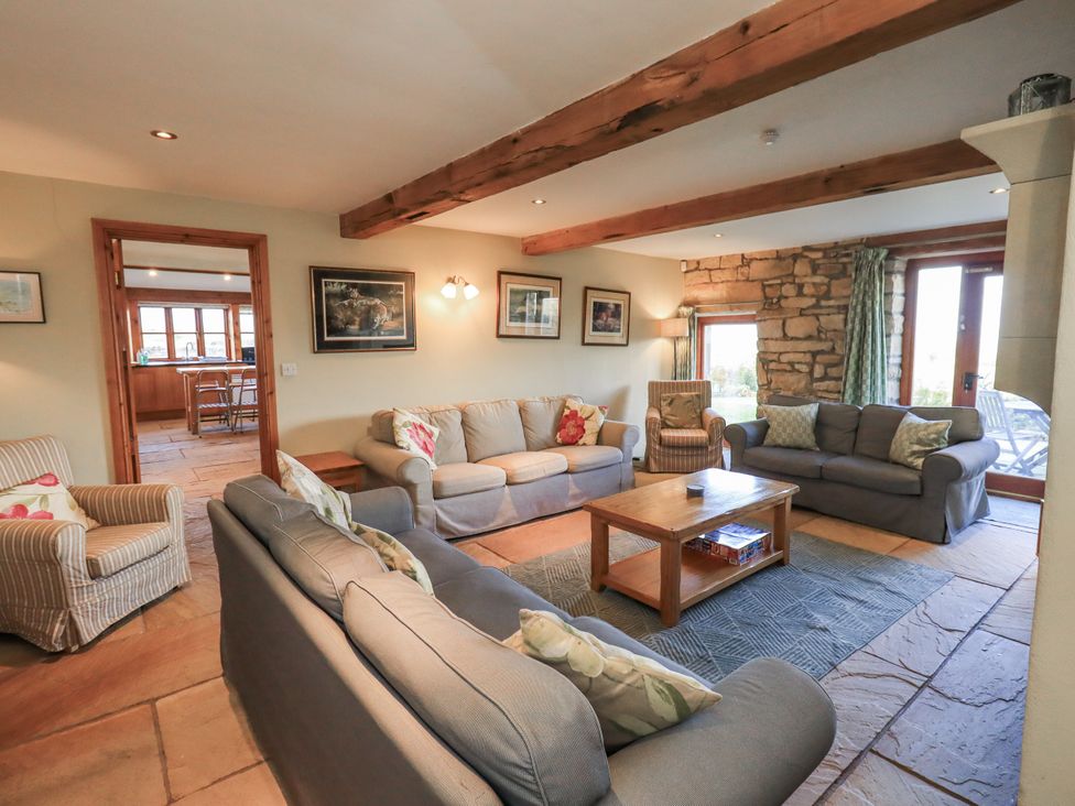 A living room with sofas and a coffee table at Usherwoods Dairy in Tatham