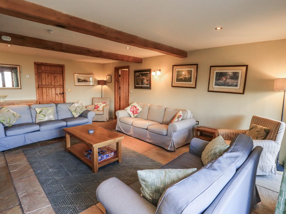 A living room with sofas and a coffee table at Usherwoods Dairy in Tatham