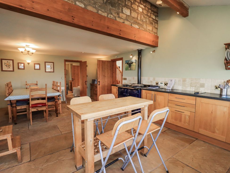 A kitchen with a table and chairs at Usherwoods Dairy in Tatham