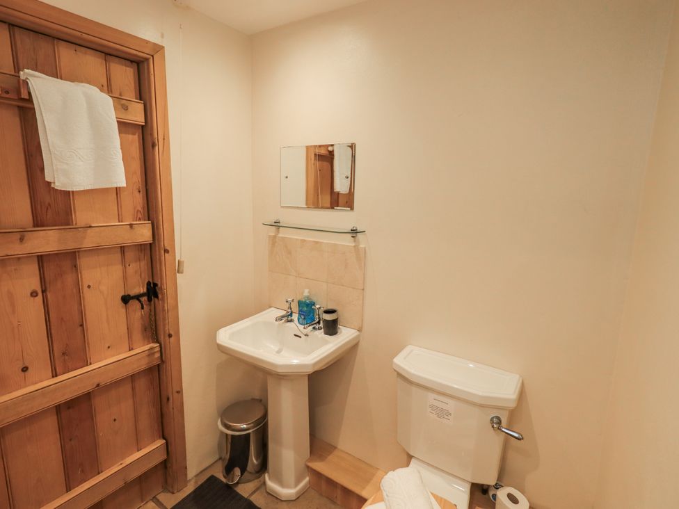A bathroom with a sink and toilet at Usherwoods Dairy Tatham