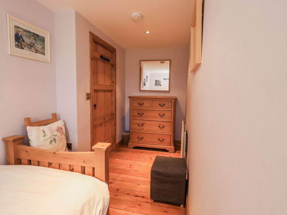 A bedroom with a bed and drawer unit at Usherwoods Dairy in Tatham