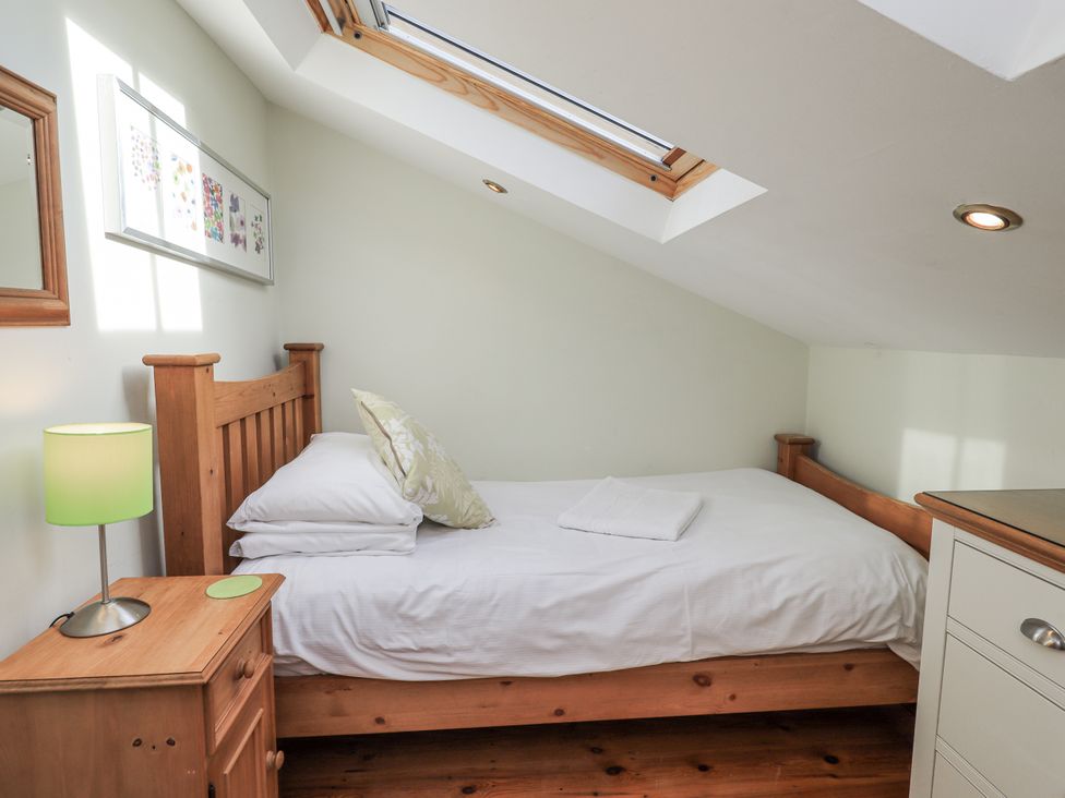 A bedroom with a bed and nightstand at Usherwoods Dairy Tatham
