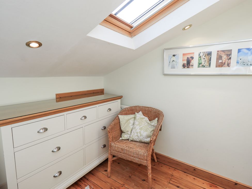 A room with a chest of drawers and a basket chair at Usherwoods Dairy, Tatham
