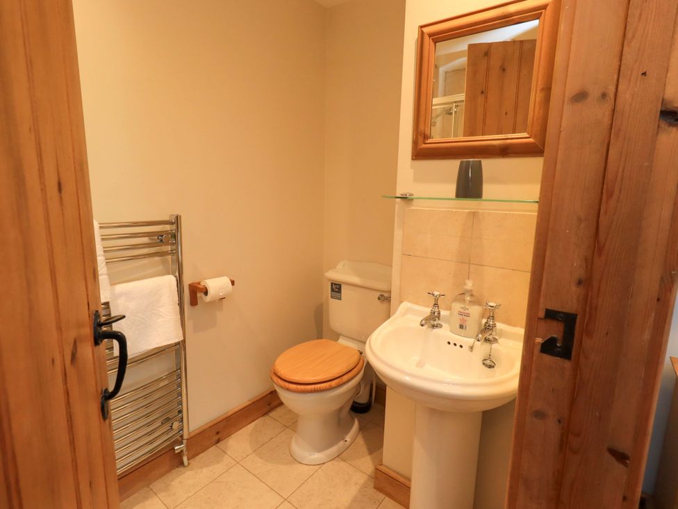 A bathroom with a sink and toilet at Usherwoods Barn Tatham