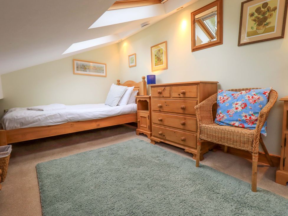 A bedroom with a bed and dresser at Usherwoods Barn in Tatham