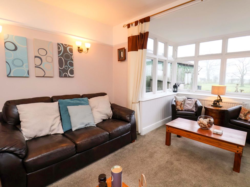 A living room with a sofa and coffee table at Dilston House in Goathland