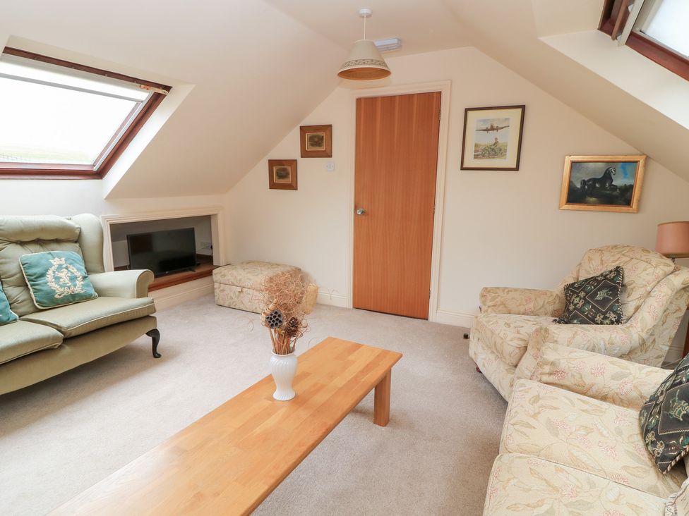 A living room with a sofa and coffee table at Uplands Over Compton near Sherborne