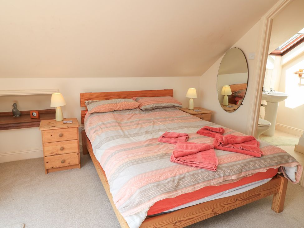 A bedroom with a bed and nightstand at Uplands Over Compton near Sherborne