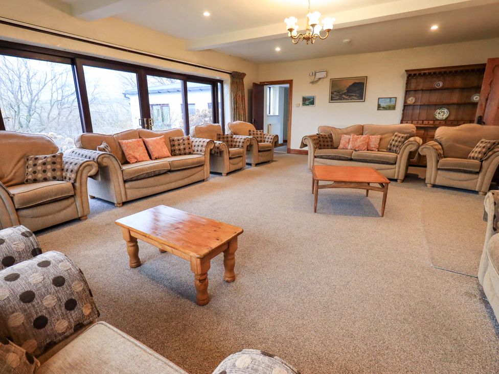 A living room with sofas and a coffee table at Ghyll Bank House Staveley near Windermere