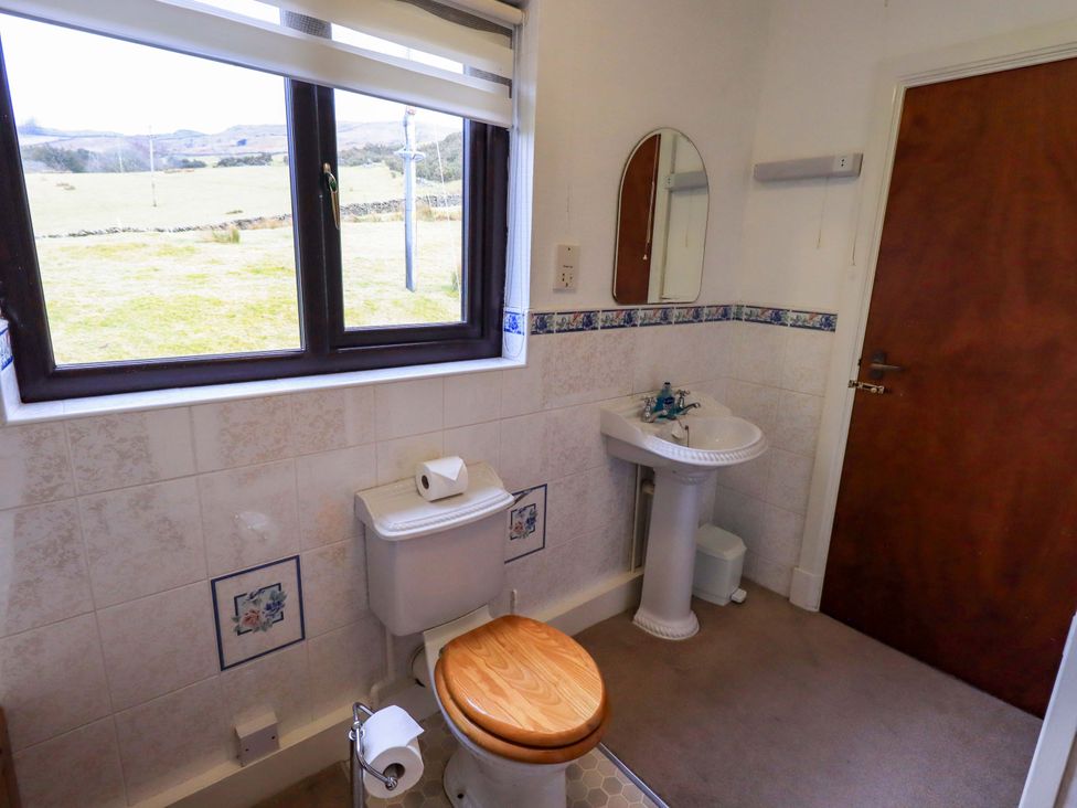 A bathroom with a toilet and sink at Ghyll Bank House Staveley near Windermere