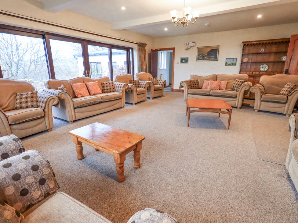 A living room with sofas and a coffee table at Ghyll Bank House Staveley near Windermere