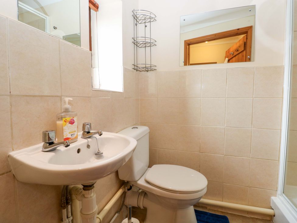 A bathroom with a sink and toilet at The Stall in Penuel near Llanmorlais